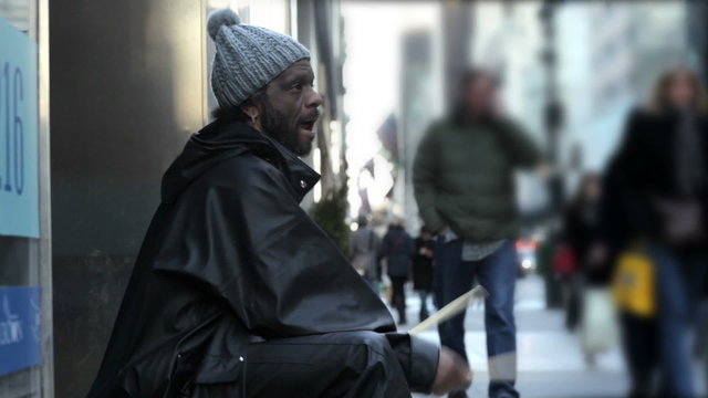Homeless Man Plays Drums on Buckets