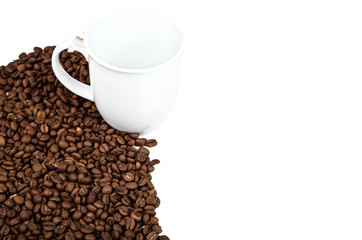 a cup near the coffee beans