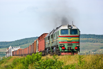 Heavy freight train pulled by diesel locomotive
