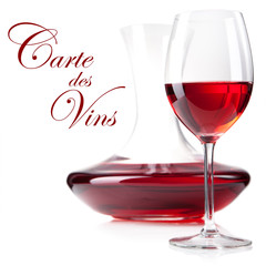 studio shot of red wine glass and decanter in vertical compositi