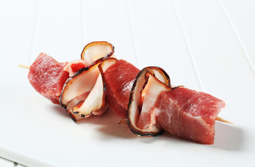 Fresh pork chunks and bacon on stick