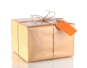 Parcel wrapped in brown paper tied with twine and with blank