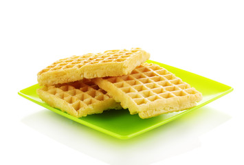 Sweet waffles on plate isolated on white