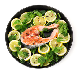 Red fish with lemon, parsley and pepper