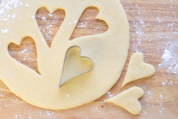 Hearts on raw dough.Closeup