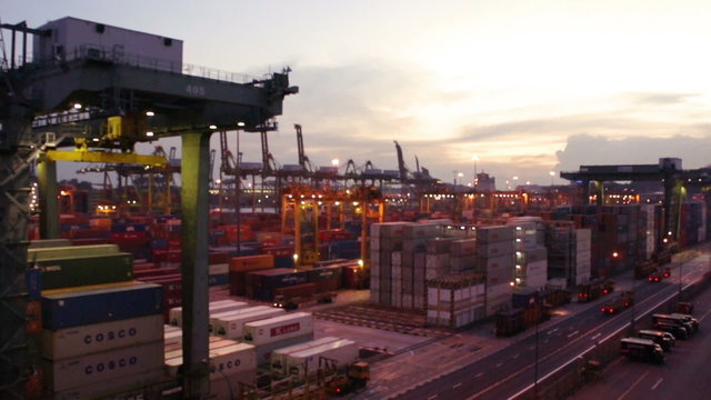 Massive Crane in a busy harbor during evening