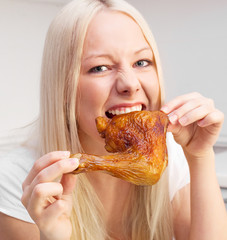 woman eating chicken