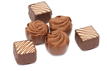 Chocolate pralines on white background