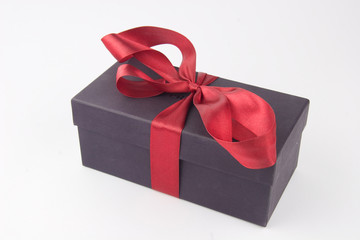Gift box with a red bow and ribbon