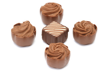 Chocolate pralines on white background