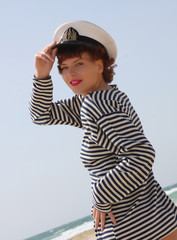 Sexy young beautiful girl in the sea shirt