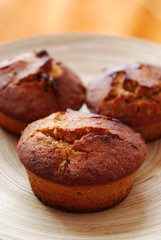Homemade muffins with hazelnuts, orange peel and raisins