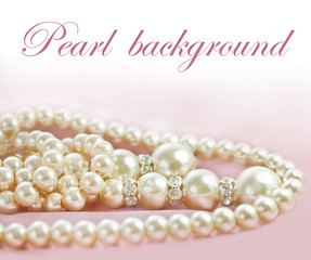 Background with Pearls  necklace on  fabric