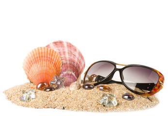 exotic shell, crystals and glasses on sand