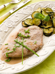 escalope with white wine sauce and sauteed zucchinis