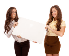 Gemini sisters hold a poster on a white background