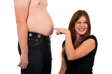girl pricking her boyfriends belly button