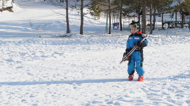 little boy with skis