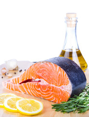Fresh salmon steak on wooden cooking desk wiht