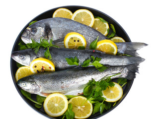Fresh fishes with lemon, parsley and pepper