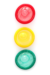 Colorful condoms isolated on white