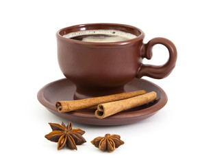Cup of coffee with anise star and cinnamon
