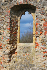 ruined church window with rural view