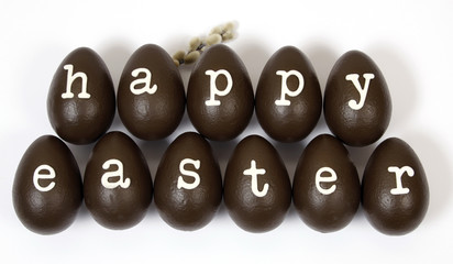 Chocolate easter eggs creating the inscription: Happy Easter.