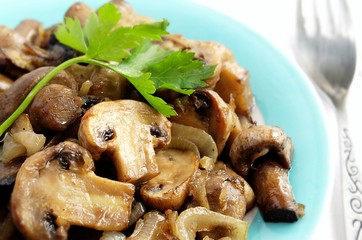 mushrooms in a bowl, decorated with greenery