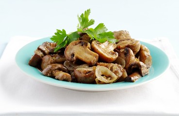mushrooms in a bowl, decorated with greenery