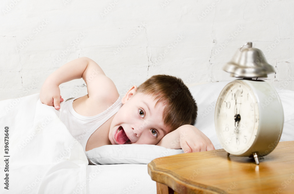 Wall mural boy awaken old alarm clock