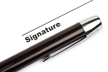 Pen and signature isolated on white