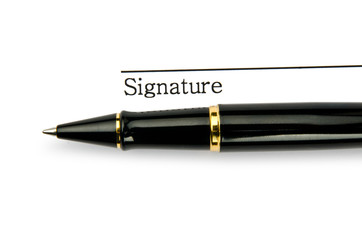 Pen and signature isolated on white