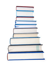 Books in high stack isolated on white