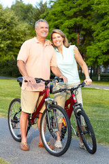 Senior couple cycling.