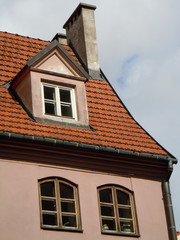 Fototapeta premium Red roof and white dormer