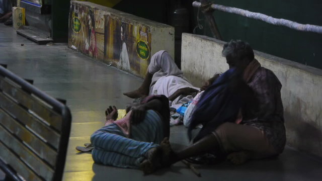 Men sleeping on a street floor