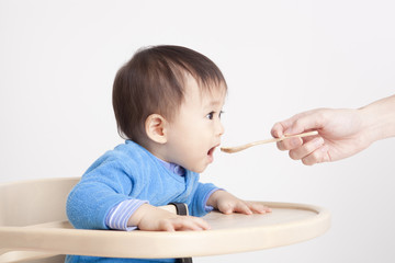 Baby eating with spoon