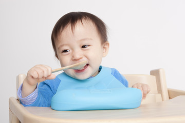 Cute baby with spoon