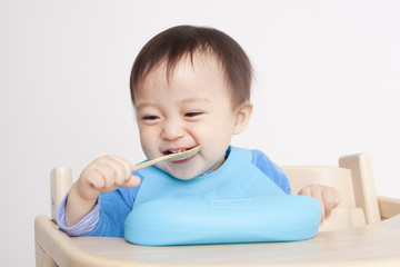 Cute baby with spoon