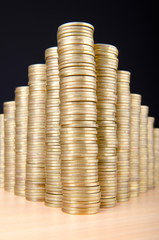 Golden coins in high stacks