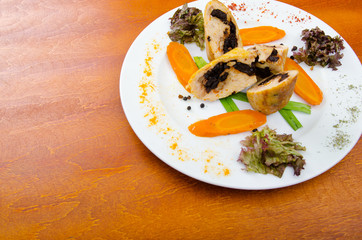 Meat and vegetable roll in plate