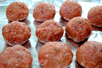 Raw meatballs ready to be baked.