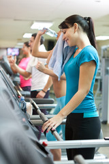 Sweating woman in gym