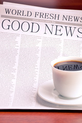 Newspaper and cup of coffee