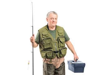 A mature fisherman holding a fishing equipment