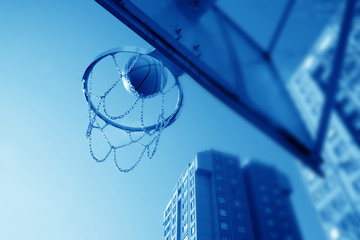 an image of playing basketball at the outside