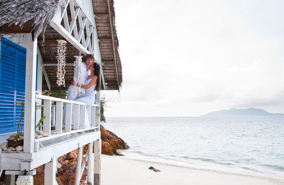 Romantic Young Couple In Tropical Beach House