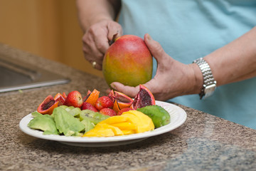 Senior asian filipino woman preparing food