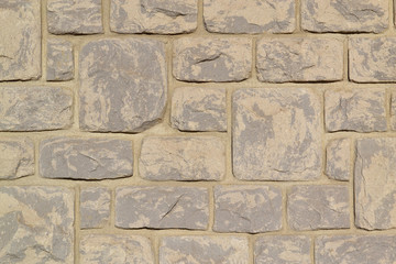 Beige stone wall.